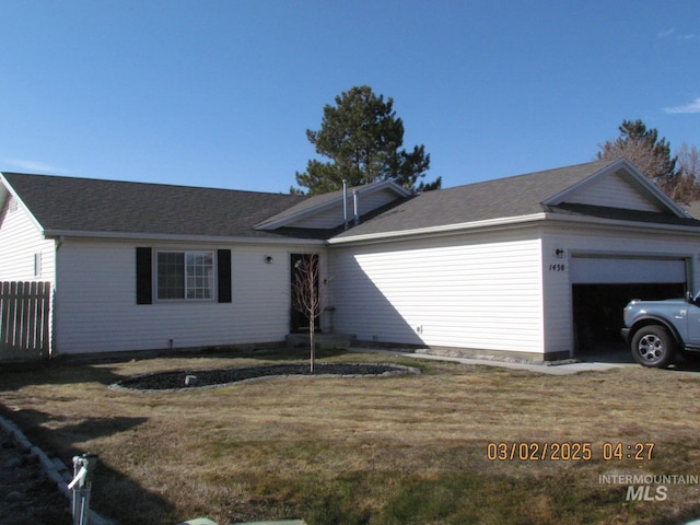 single story home featuring a garage, a front yard, and fence