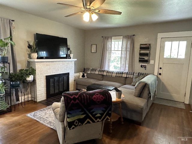 821 3rd St, Lewiston, ID 83501 - living area with wood finished floors, ceiling fan, and a brick fireplace
