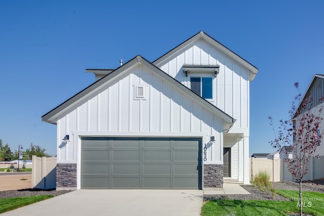5011 S Amorita Ave, Meridian, ID 83642 - modern inspired farmhouse featuring board and batten siding, stone siding, concrete driveway, and an attached garage