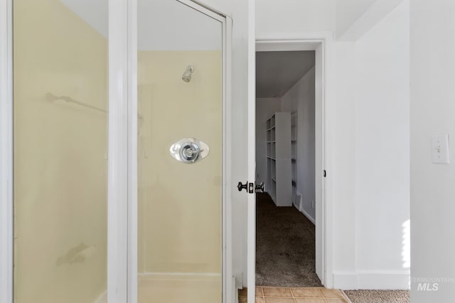 full bathroom with tile patterned flooring and a walk in shower