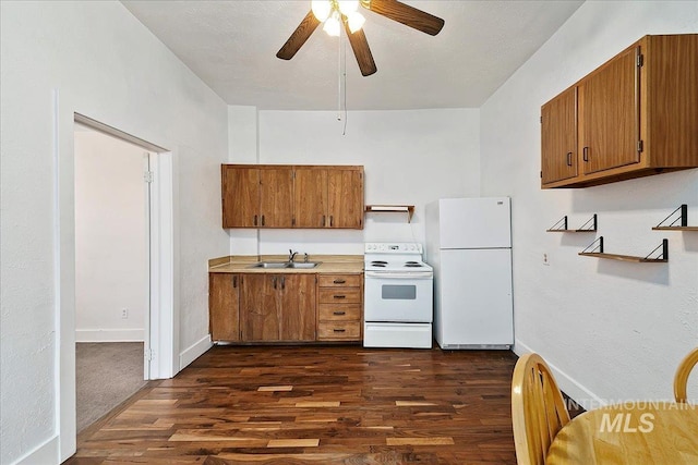 kitchen with brown cabinets, light countertops, dark wood-type flooring, a sink, and white appliances