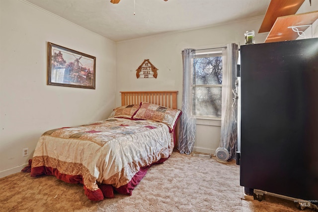 bedroom featuring carpet flooring, ceiling fan, and ornamental molding