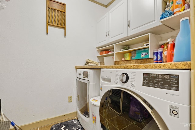 laundry area with cabinets and washing machine and dryer