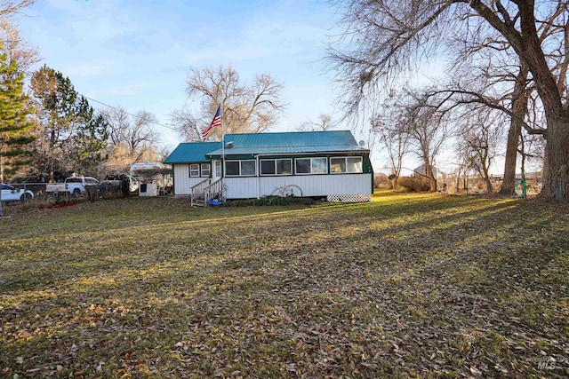 back of house with a yard