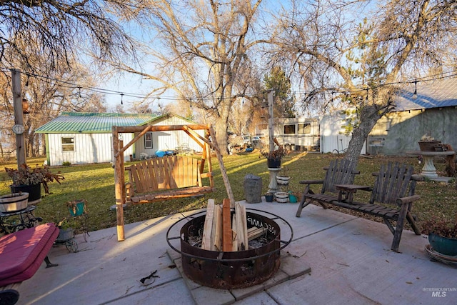 view of patio with an outdoor fire pit