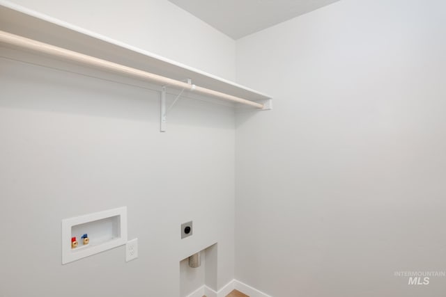 washroom with baseboards, hookup for a washing machine, laundry area, and electric dryer hookup