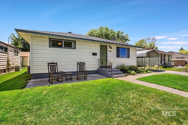 1984 11th Ave E, Twin Falls, ID 83301 - view of front of property featuring a front lawn and central air condition unit