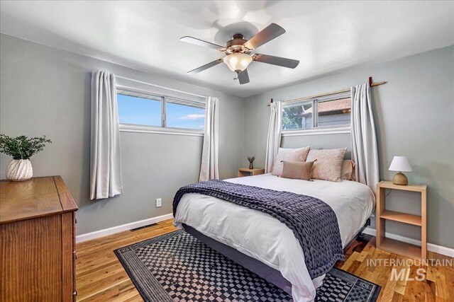 1984 11th Ave E, Twin Falls, ID 83301 - bedroom with baseboards, light wood-style flooring, and a ceiling fan