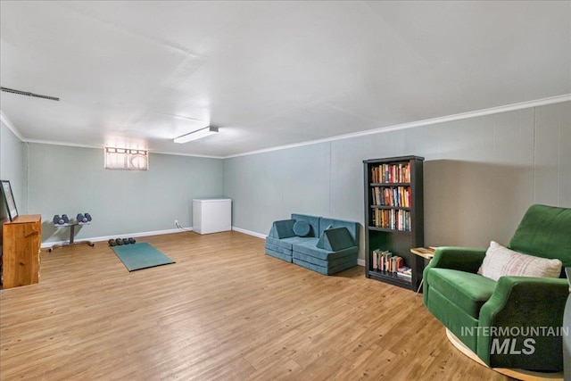 1984 11th Ave E, Twin Falls, ID 83301 - sitting room with wood finished floors, crown molding, and baseboards