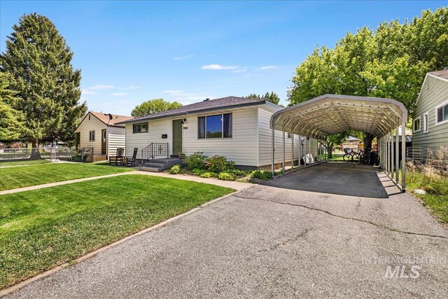 1984 11th Ave E, Twin Falls, ID 83301 - view of front facade with a detached carport and asphalt driveway