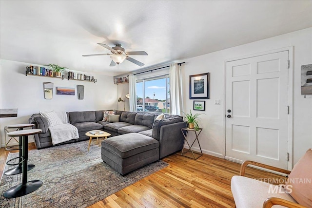 1984 11th Ave E, Twin Falls, ID 83301 - living area featuring ceiling fan, light wood-style floors, and baseboards