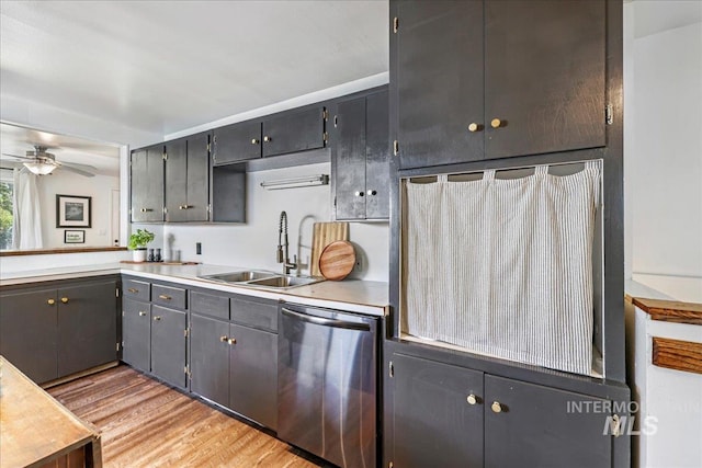 1984 11th Ave E, Twin Falls, ID 83301 - kitchen with stainless steel dishwasher, a sink, ceiling fan, light wood-style flooring, and light countertops