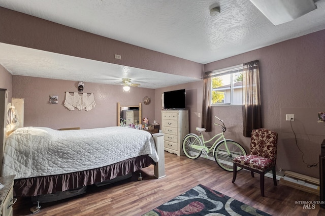 2819 Gemini, Caldwell, ID 83605 - bedroom with a textured wall, wood finished floors, a textured ceiling, and a ceiling fan