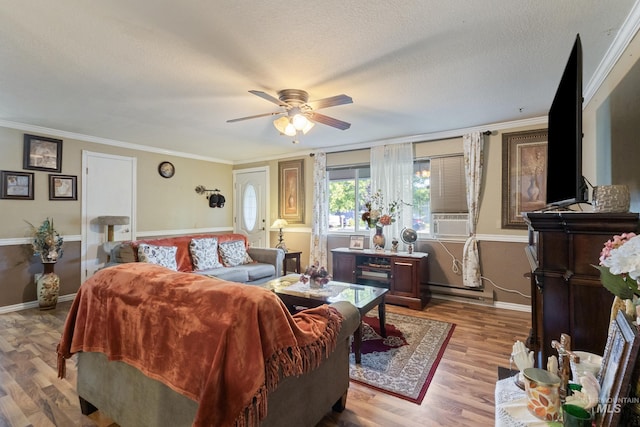 2819 Gemini, Caldwell, ID 83605 - living area with a ceiling fan, wood finished floors, crown molding, baseboards, and cooling unit