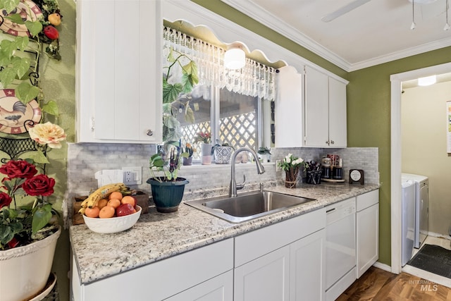 2819 Gemini, Caldwell, ID 83605 - kitchen with dishwasher, a sink, washing machine and clothes dryer, ornamental molding, and white cabinetry