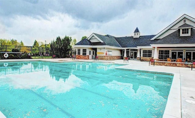 view of pool featuring a patio