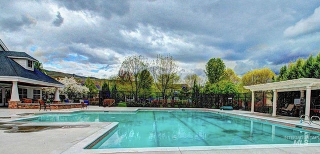 view of pool featuring a pergola and a patio area