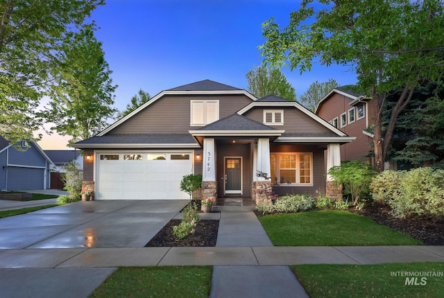3742 N Heritage View Ave, Meridian, ID 83646 - view of front facade with driveway, stone siding, a yard, and an attached garage