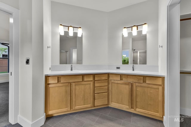 3742 N Heritage View Ave, Meridian, ID 83646 - bathroom featuring a stall shower, double vanity, plenty of natural light, and tile patterned floors