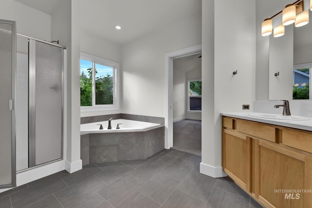 3742 N Heritage View Ave, Meridian, ID 83646 - bathroom featuring vanity, a shower stall, a garden tub, and tile patterned flooring