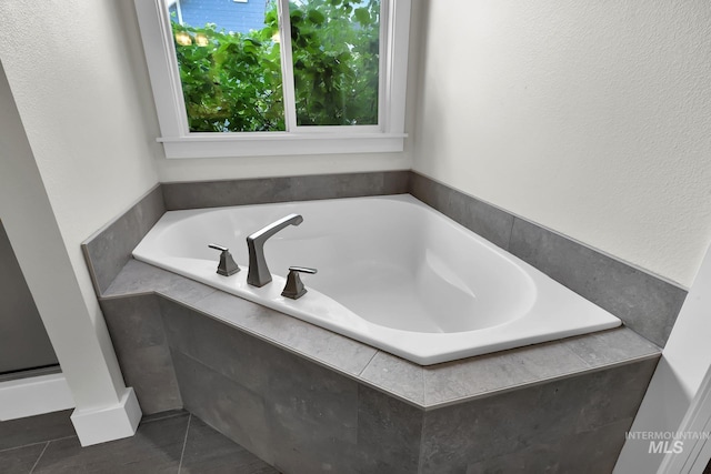 3742 N Heritage View Ave, Meridian, ID 83646 - bathroom with a garden tub and tile patterned floors