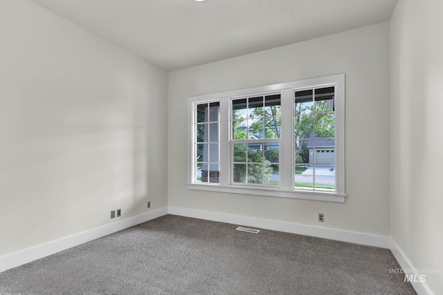 3742 N Heritage View Ave, Meridian, ID 83646 - spare room with dark carpet and baseboards