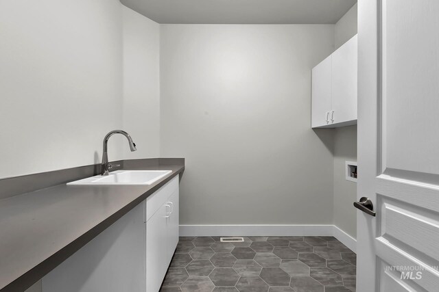 3742 N Heritage View Ave, Meridian, ID 83646 - laundry area featuring cabinet space, washer hookup, and baseboards