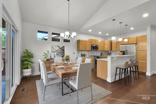 3742 N Heritage View Ave, Meridian, ID 83646 - dining space with lofted ceiling, dark wood-type flooring, a chandelier, recessed lighting, and baseboards