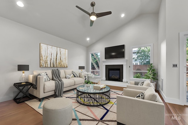 3742 N Heritage View Ave, Meridian, ID 83646 - living area featuring a ceiling fan, a glass covered fireplace, plenty of natural light, recessed lighting, and high vaulted ceiling