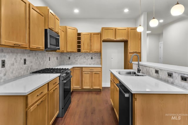3742 N Heritage View Ave, Meridian, ID 83646 - kitchen with black range with gas cooktop, dishwasher, a sink, stainless steel microwave, and dark wood-type flooring
