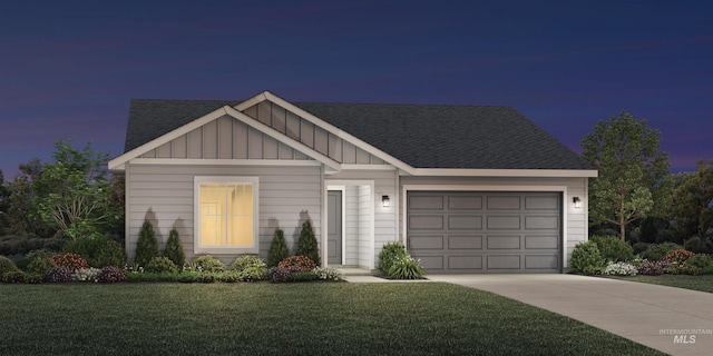 view of front facade featuring driveway, a front yard, board and batten siding, and an attached garage