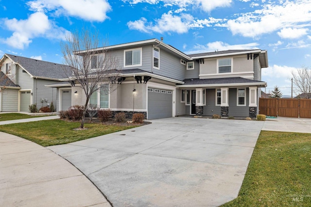 view of front facade featuring a front lawn and a garage