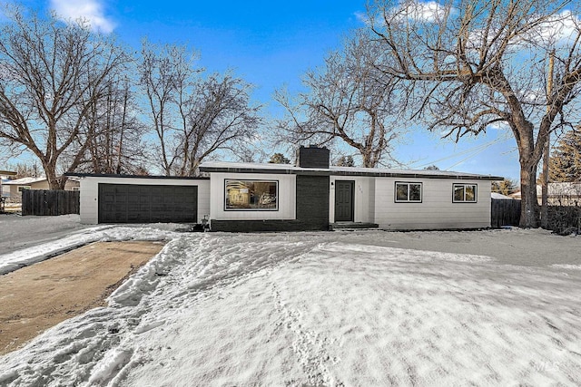 ranch-style home with a garage