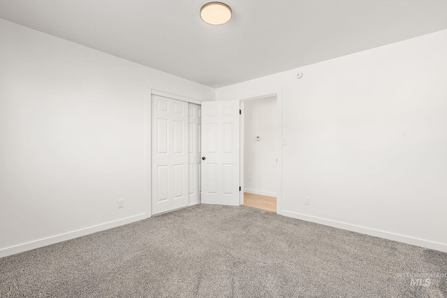 unfurnished room featuring carpet flooring