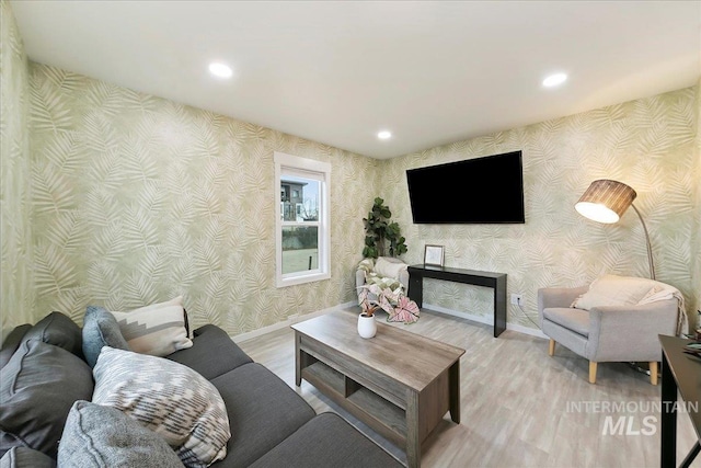 living room with light hardwood / wood-style flooring