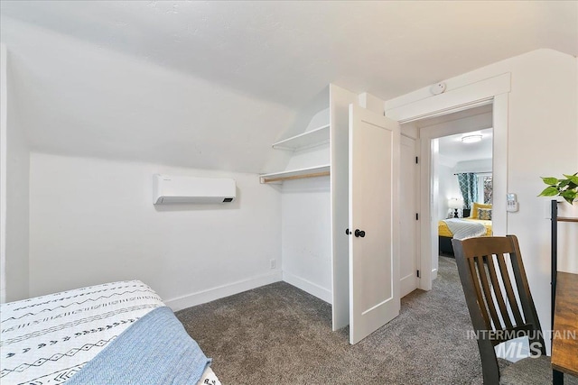 carpeted bedroom with a wall mounted AC