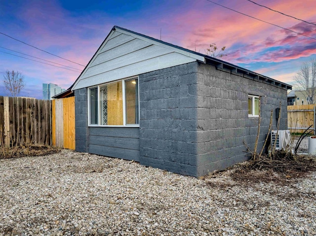 property exterior at dusk with ac unit