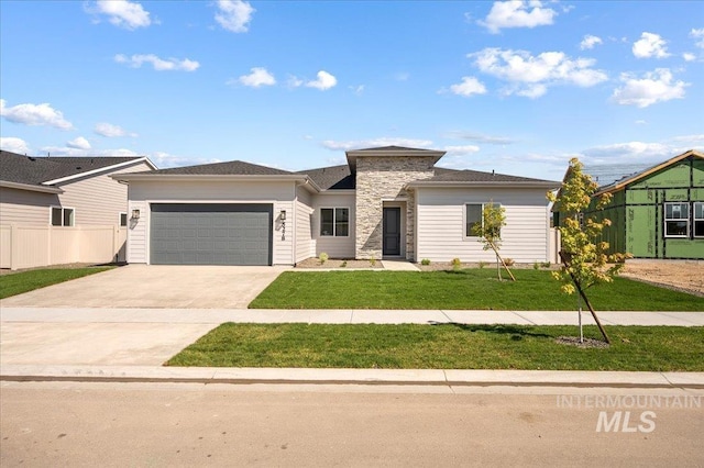 5278 W Mcnair St, Meridian, ID 83646 - view of front of property with a garage, driveway, and stone siding