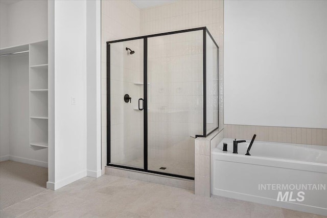 5278 W Mcnair St, Meridian, ID 83646 - full bath with a shower stall, a bath, and baseboards