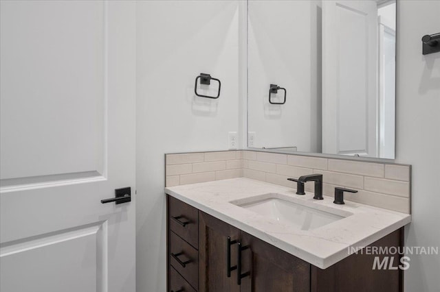 5278 W Mcnair St, Meridian, ID 83646 - bathroom featuring vanity and tasteful backsplash