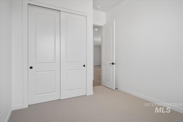 5278 W Mcnair St, Meridian, ID 83646 - unfurnished bedroom with light carpet, a closet, and baseboards