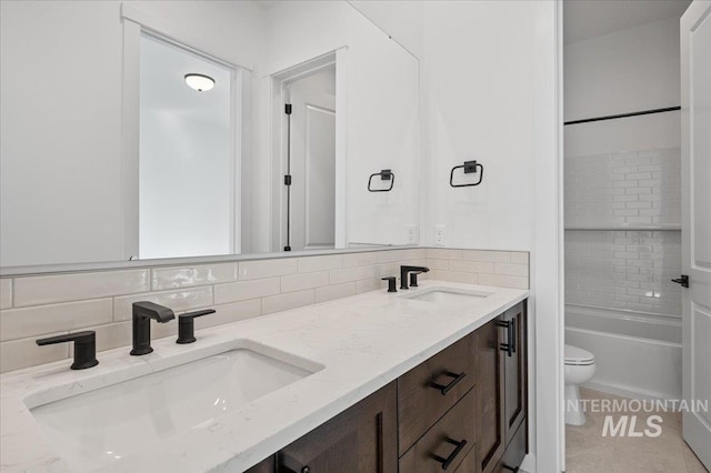 5278 W Mcnair St, Meridian, ID 83646 - bathroom with toilet, double vanity, tasteful backsplash, shower / tub combination, and tile patterned floors