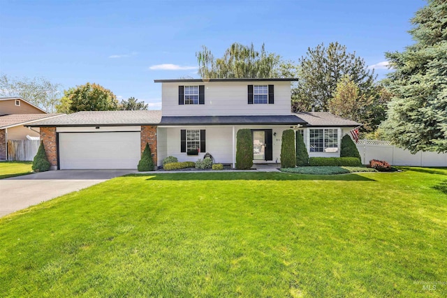 955 Bitterroot Pl, Twin Falls, ID 83301 - traditional home featuring a garage, concrete driveway, and brick siding