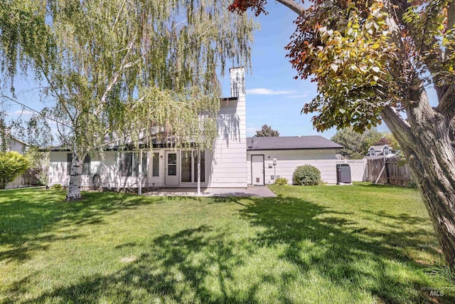 955 Bitterroot Pl, Twin Falls, ID 83301 - rear view of property with a chimney, central AC, and a patio