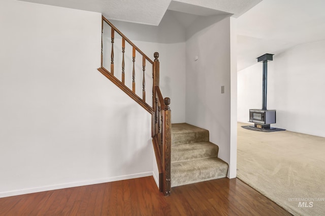 955 Bitterroot Pl, Twin Falls, ID 83301 - stairway with a wood stove, wood finished floors, and baseboards
