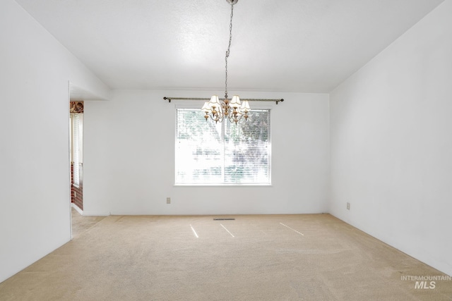 955 Bitterroot Pl, Twin Falls, ID 83301 - spare room featuring carpet floors and a chandelier