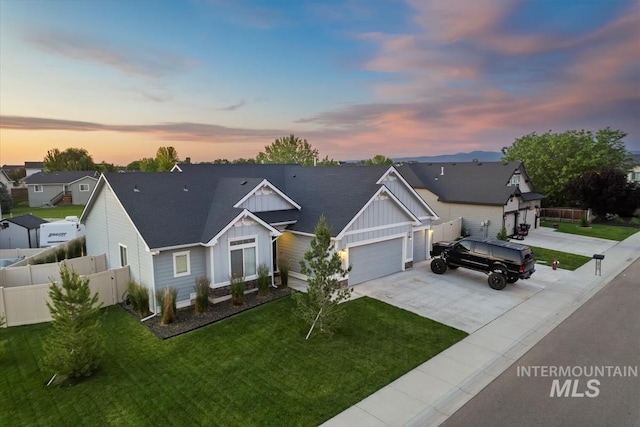 2982 W Mcintosh, Kuna, ID 83634 - view of front of house with board and batten siding, concrete driveway, a garage, a residential view, and roof with shingles