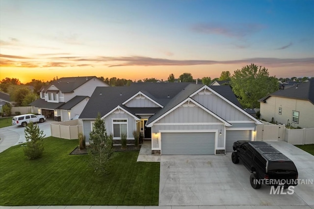 2982 W Mcintosh, Kuna, ID 83634 - view of front of property featuring board and batten siding, an attached garage, driveway, and a residential view