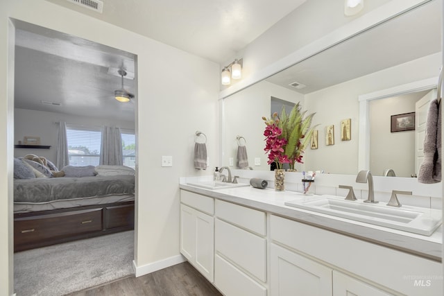 2982 W Mcintosh, Kuna, ID 83634 - full bath with ensuite bath, wood finished floors, double vanity, and baseboards