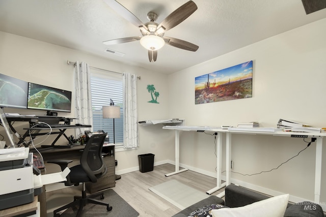 2982 W Mcintosh, Kuna, ID 83634 - office space featuring wood finished floors, ceiling fan, baseboards, and a textured ceiling